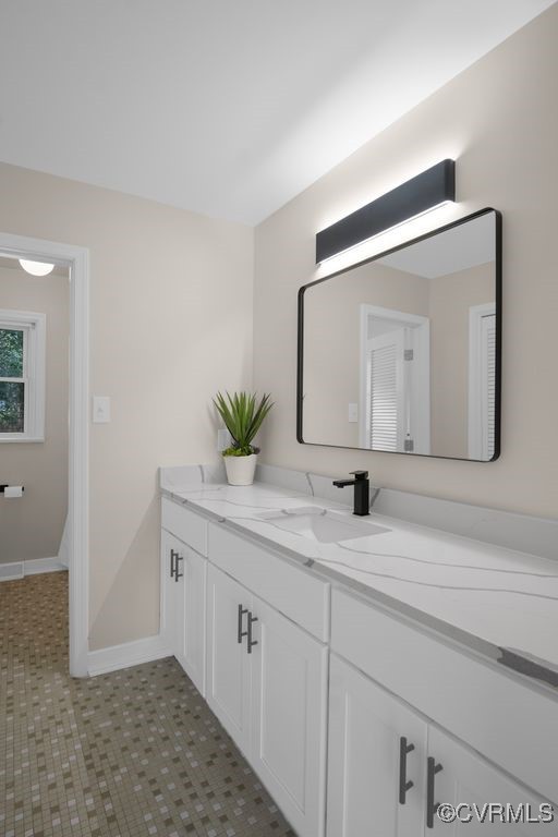 11511 Rochelle Road Chester, VA 23831 - Photo 27 of 32 a bathroom with a double vanity sink and a mirror