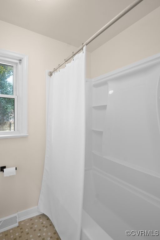 11511 Rochelle Road Chester, VA 23831 - Photo 28 of 32 a bathroom with a glass shower door