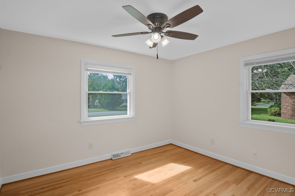 11511 Rochelle Road Chester, VA 23831 - Photo 29 of 32 en empty room with wooden floor and window