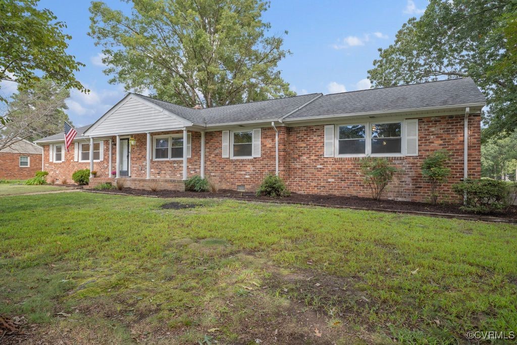 11511 Rochelle Road Chester, VA 23831 - Photo 3 of 32 a front view of a house with garden