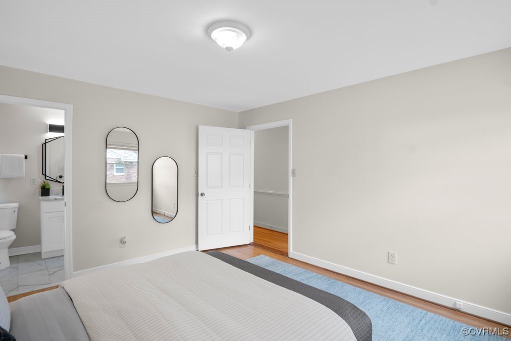 11511 Rochelle Road Chester, VA 23831 - Photo 31 of 32 a bedroom with a large window and a wooden floor
