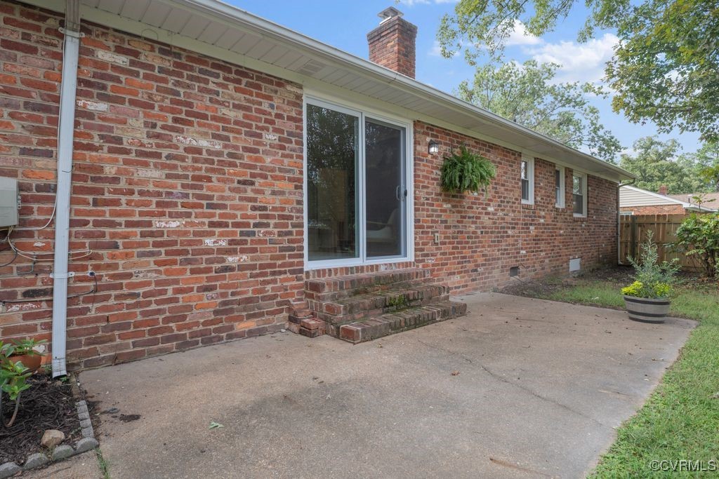 11511 Rochelle Road Chester, VA 23831 - Photo 7 of 32 a brick house with a yard