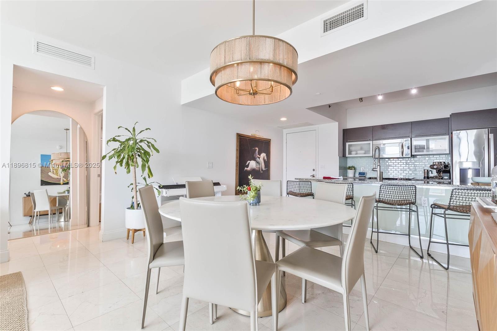 951 Brickell Avenue, Unit 1606 Miami, FL 33131 - Photo 7 of 30 a view of a dining room with furniture