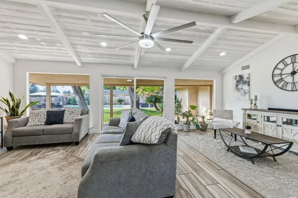 a swimming pool view with a outdoor seating