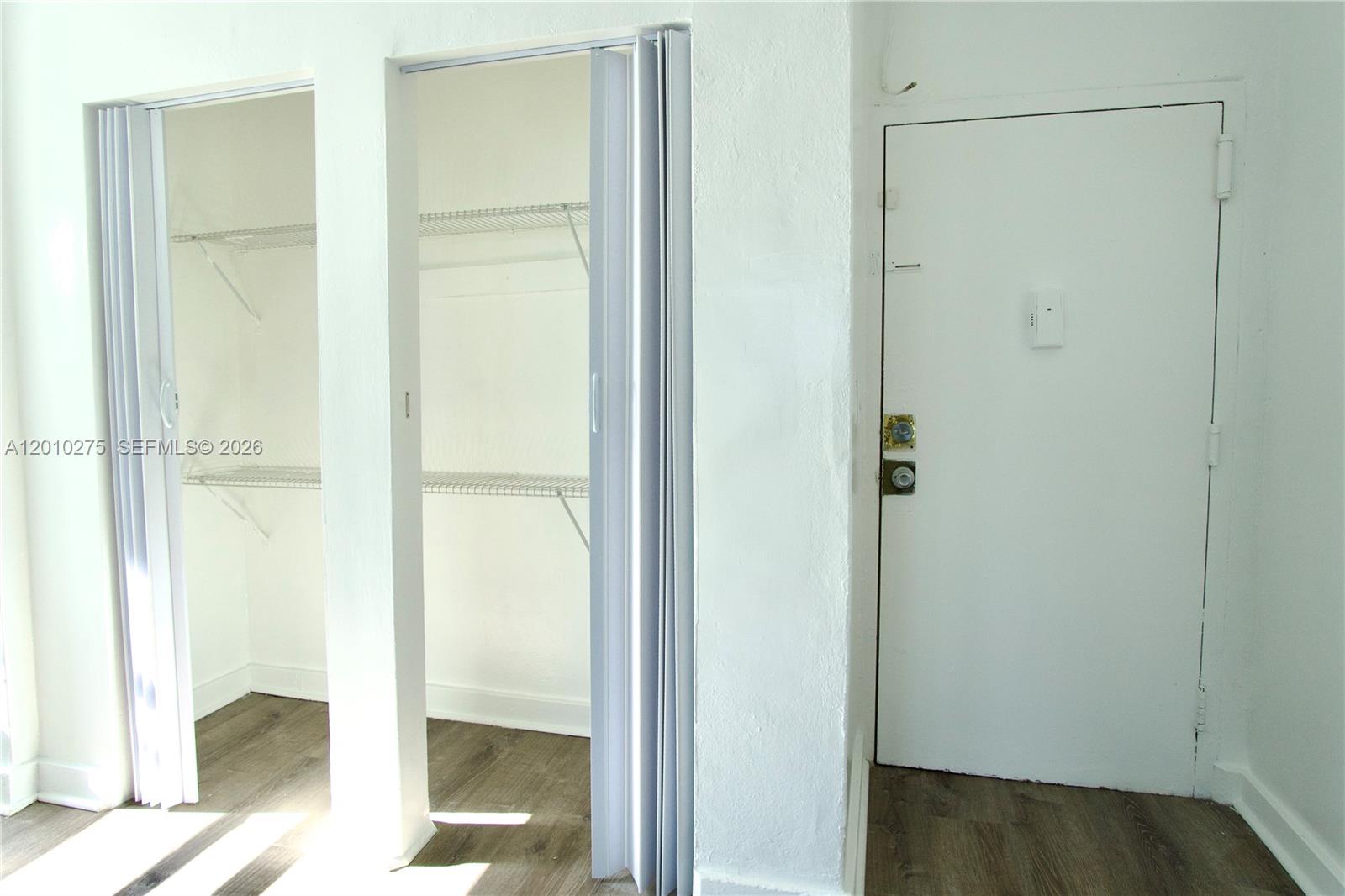 501 Southwest 6th Court, Unit 319 Miami, FL 33130 - Photo 14 of 15 a bathroom with a glass shower door