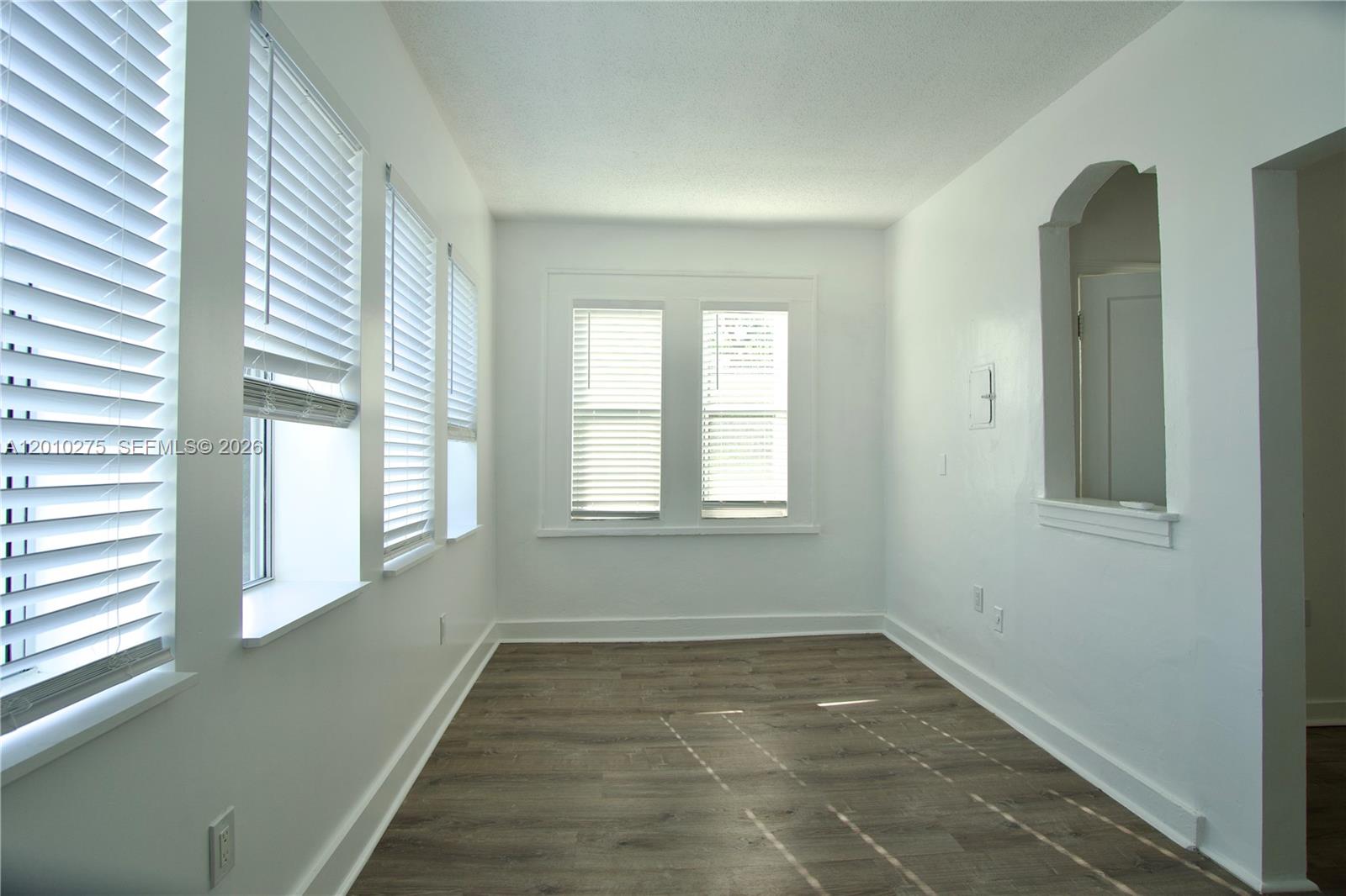 501 Southwest 6th Court, Unit 319 Miami, FL 33130 - Photo 4 of 15 a view of an empty room with a window