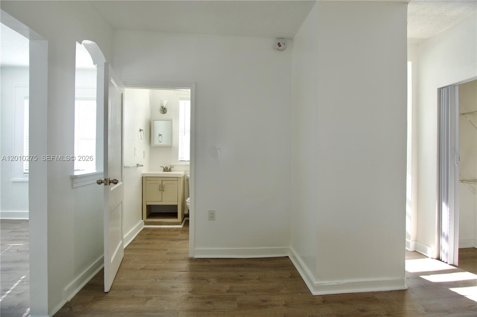 501 Southwest 6th Court, Unit 319 Miami, FL 33130 - Photo 7 of 15 a view of a hallway with wooden floor