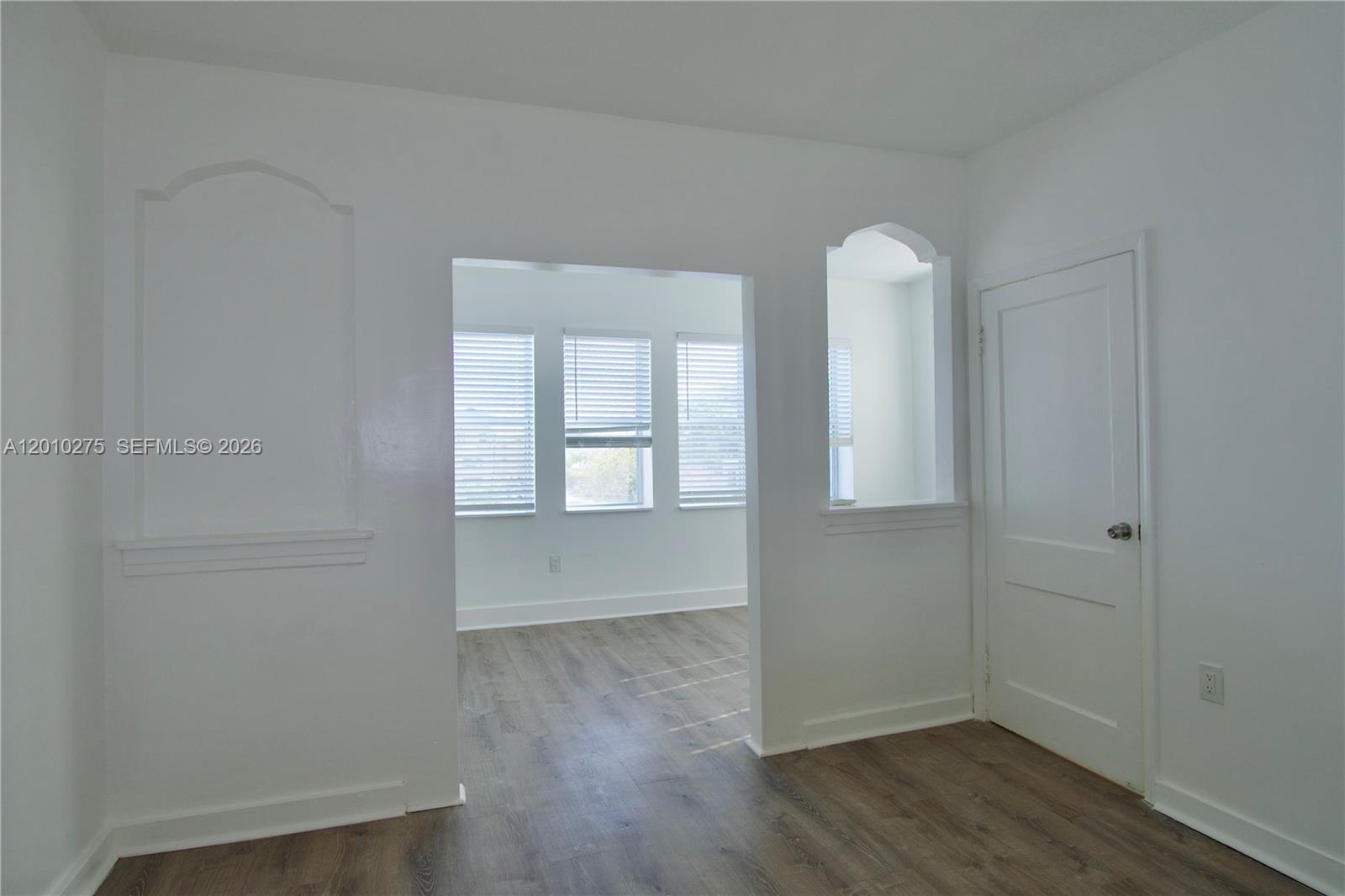 501 Southwest 6th Court, Unit 319 Miami, FL 33130 - Photo 10 of 15 wooden floor in an empty room