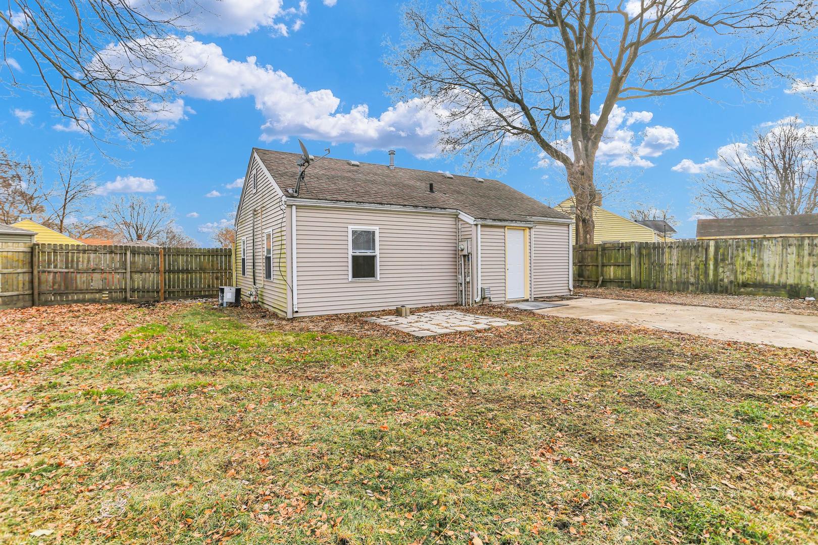 15 Gerald Road Rantoul, IL 61866 - Photo 1 of 19 a view of a backyard with a large tree