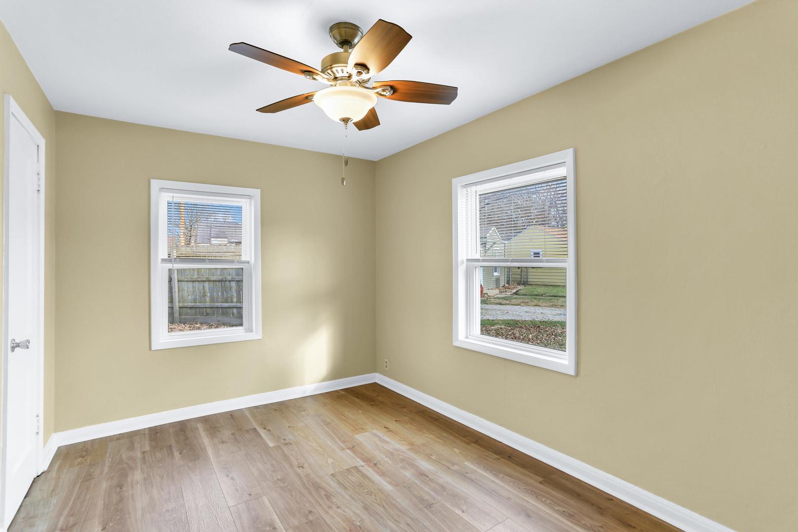15 Gerald Road Rantoul, IL 61866 - Photo 11 of 19 a view of an empty room with a window and wooden floor