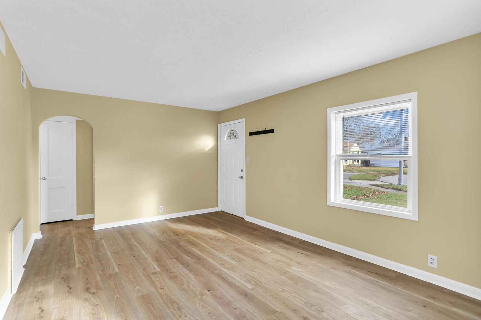15 Gerald Road Rantoul, IL 61866 - Photo 16 of 19 a view of an empty room with wooden floor and a window