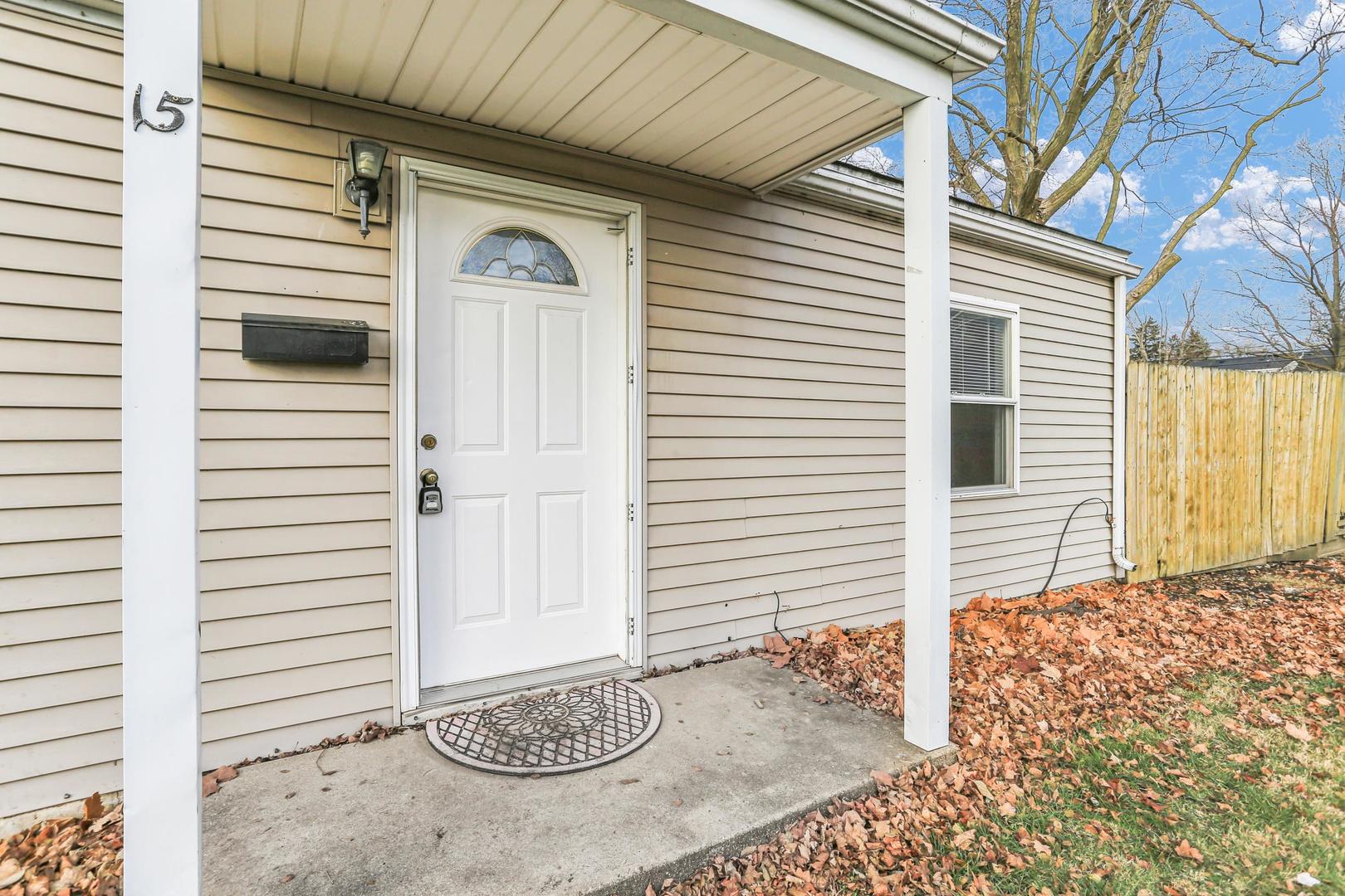 15 Gerald Road Rantoul, IL 61866 - Photo 3 of 19 a front view of a house with garage