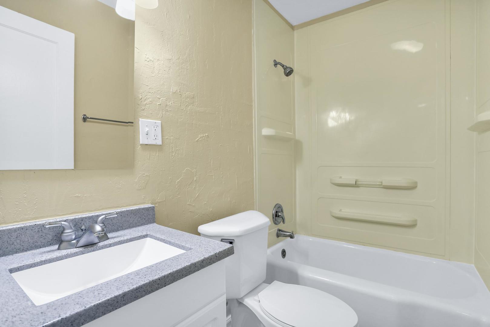 15 Gerald Road Rantoul, IL 61866 - Photo 10 of 19 a bathroom with a sink toilet vanity and shower