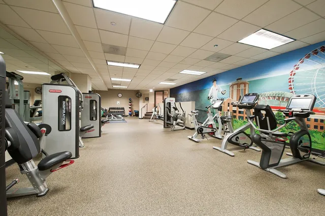 a view of a patio with couches table and chairs and potted plants