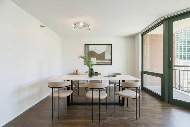 a view of a dining room with furniture and wooden floor