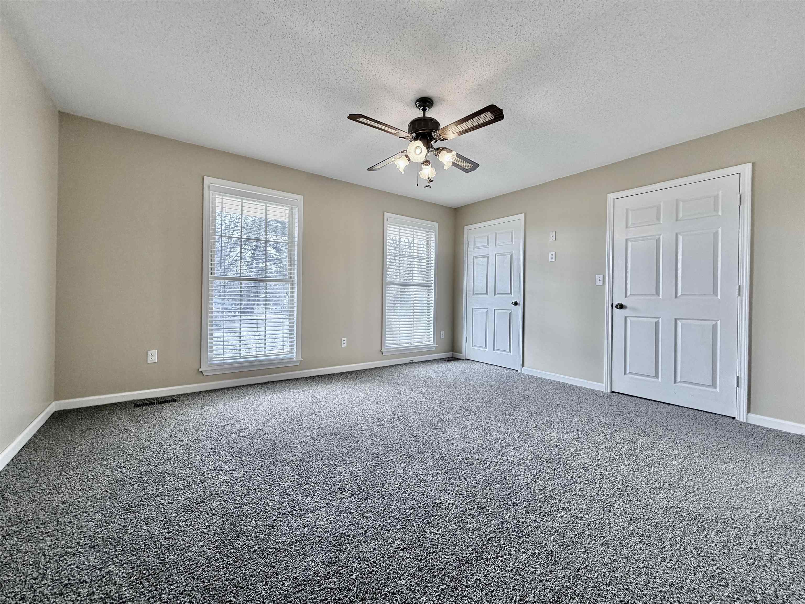 1086 Sloan Road Burlison, TN 38015 - Photo 16 of 24 Unfurnished bedroom featuring carpet, a ceiling fan, and a textured ceiling