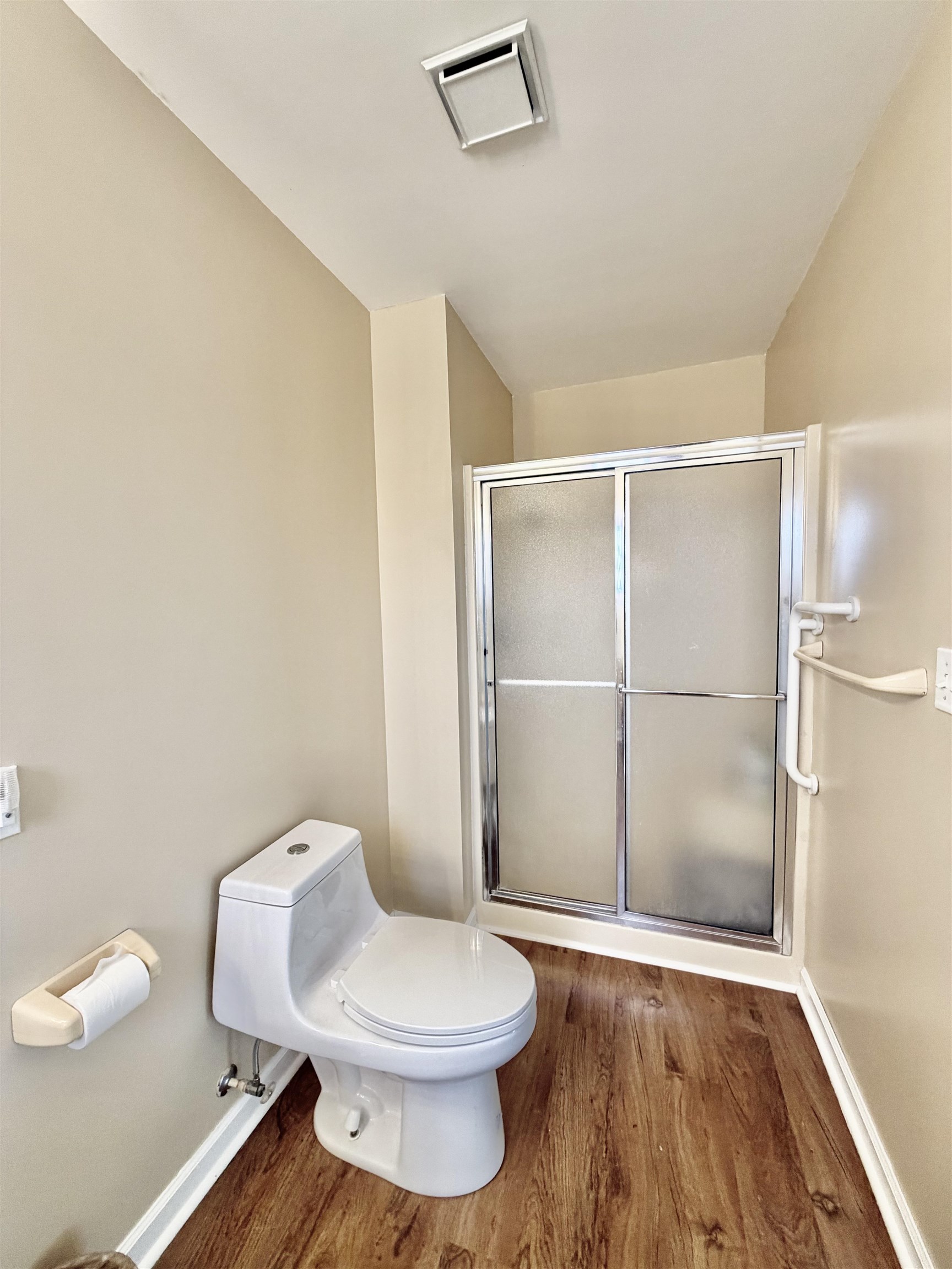 1086 Sloan Road Burlison, TN 38015 - Photo 9 of 24 Full bathroom with a stall shower and wood finished floors