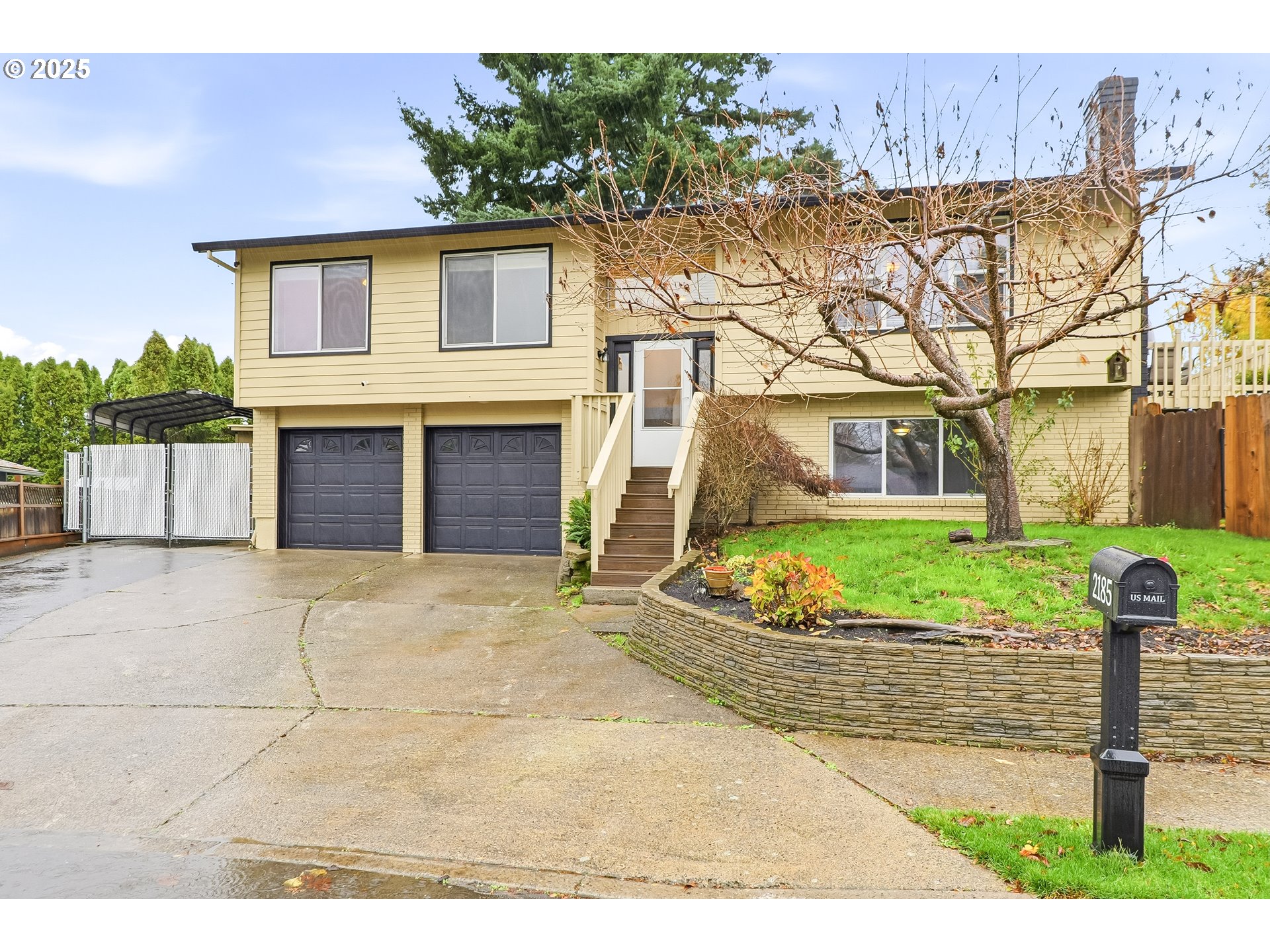 2185 Southwest 9th Court Gresham, OR 97080 - Photo 1 of 28 a front view of a house with garden