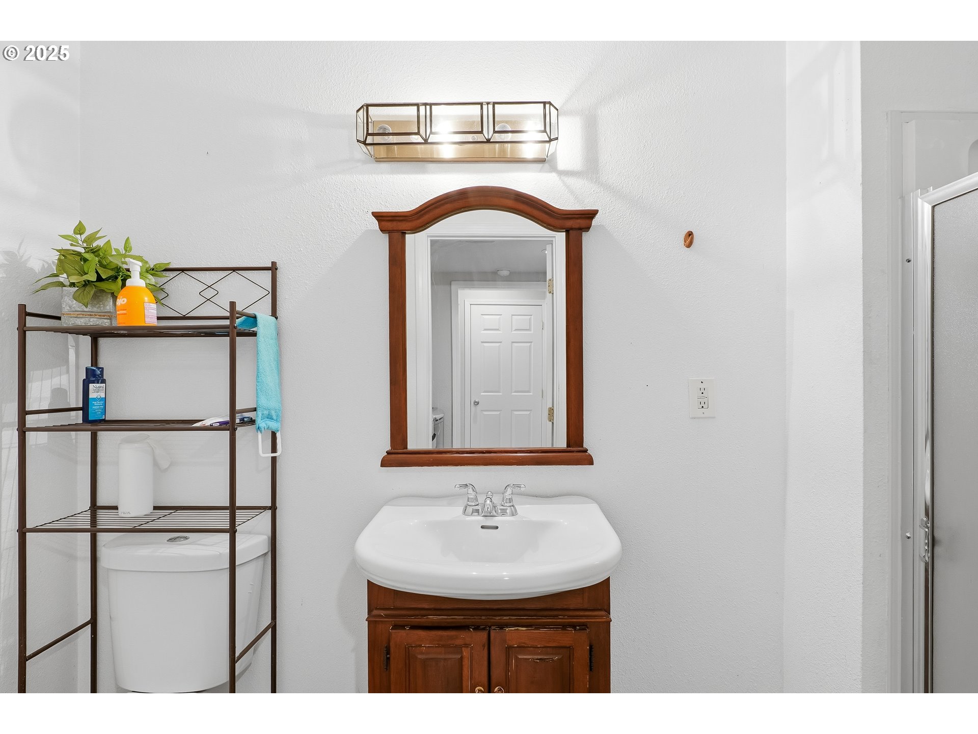 2185 Southwest 9th Court Gresham, OR 97080 - Photo 16 of 28 a bathroom with a sink and a mirror