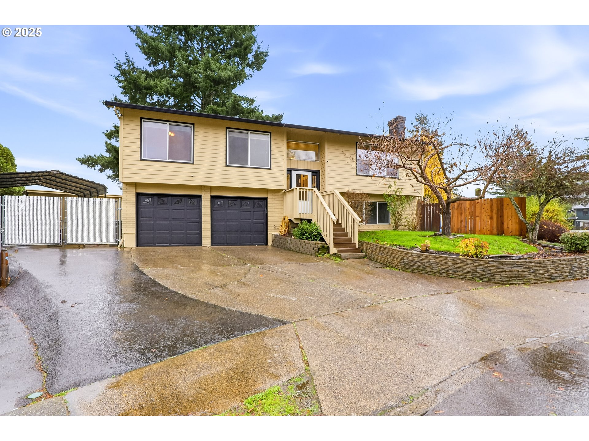 2185 Southwest 9th Court Gresham, OR 97080 - Photo 2 of 28 a front view of a house with a yard and garage