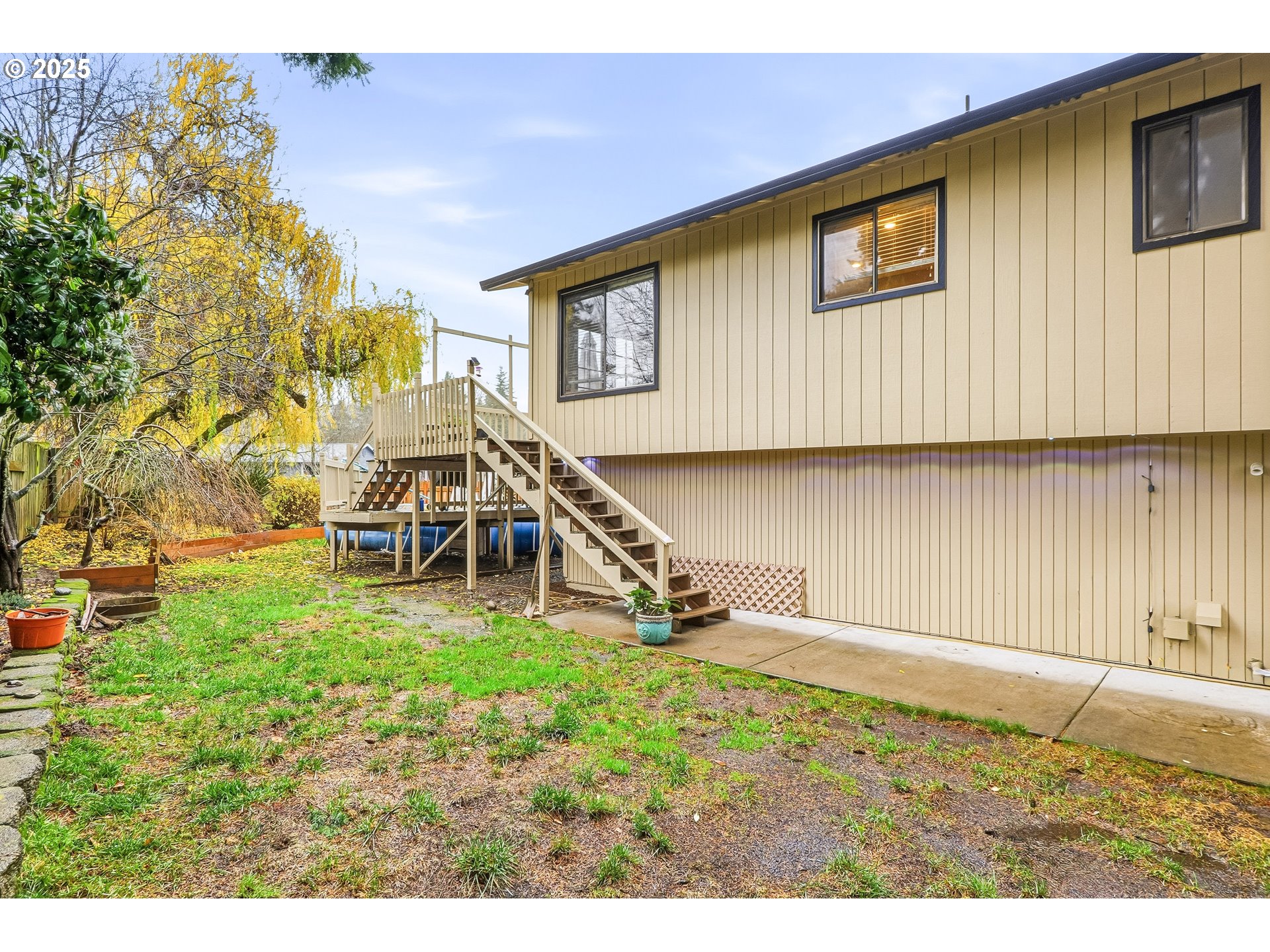 2185 Southwest 9th Court Gresham, OR 97080 - Photo 22 of 28 a view of an house with backyard and deck