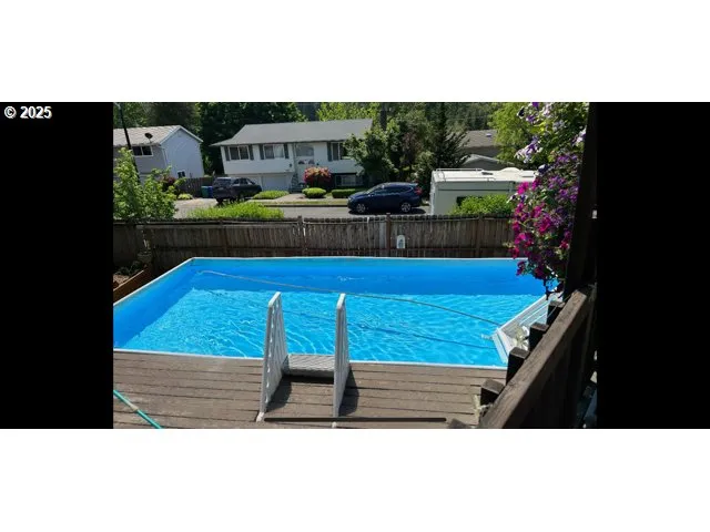 a view of swimming pool with seating space
