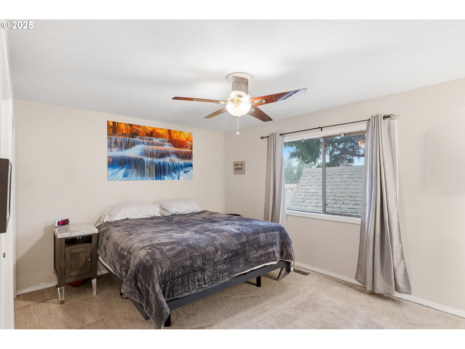 2185 Southwest 9th Court Gresham, OR 97080 - Photo 10 of 28 a bedroom with a bed and a chandelier