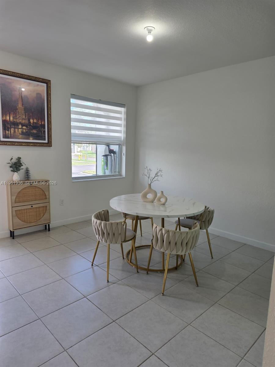 29224 Southwest 162nd Avenue Homestead, FL 33033 - Photo 8 of 26 a living room with furniture and a window