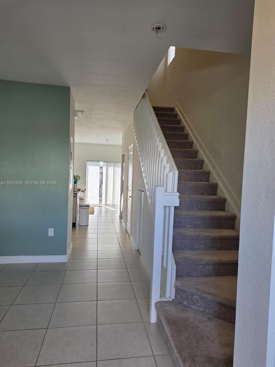 29224 Southwest 162nd Avenue Homestead, FL 33033 - Photo 9 of 26 a view of entryway and hall with a window