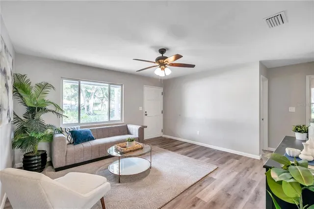 a living room with furniture and a window