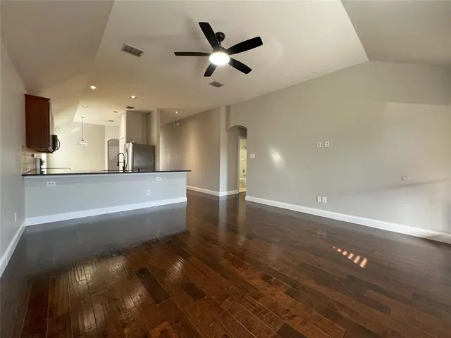 a view of a kitchen with a sink and a window