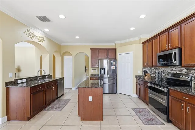 a kitchen with a table and chairs in it