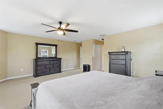 a spacious bathroom with a tub shower and sink