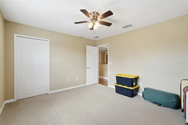 a living room with a bed furniture and a window