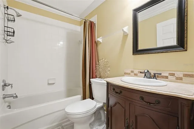 a spacious bedroom with a bed and a dresser