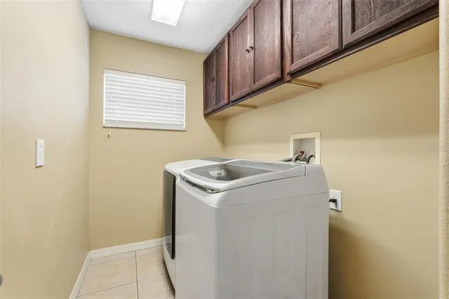 a bedroom with furniture and a chandelier