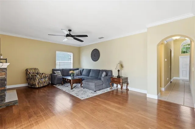 a living room with furniture and a large window
