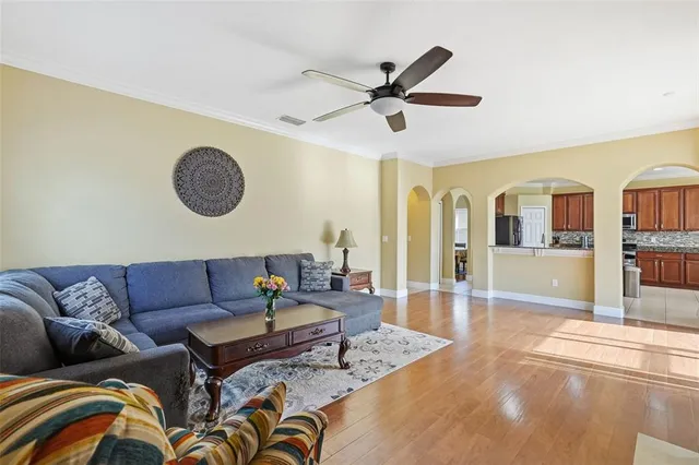a living room with furniture and a large window