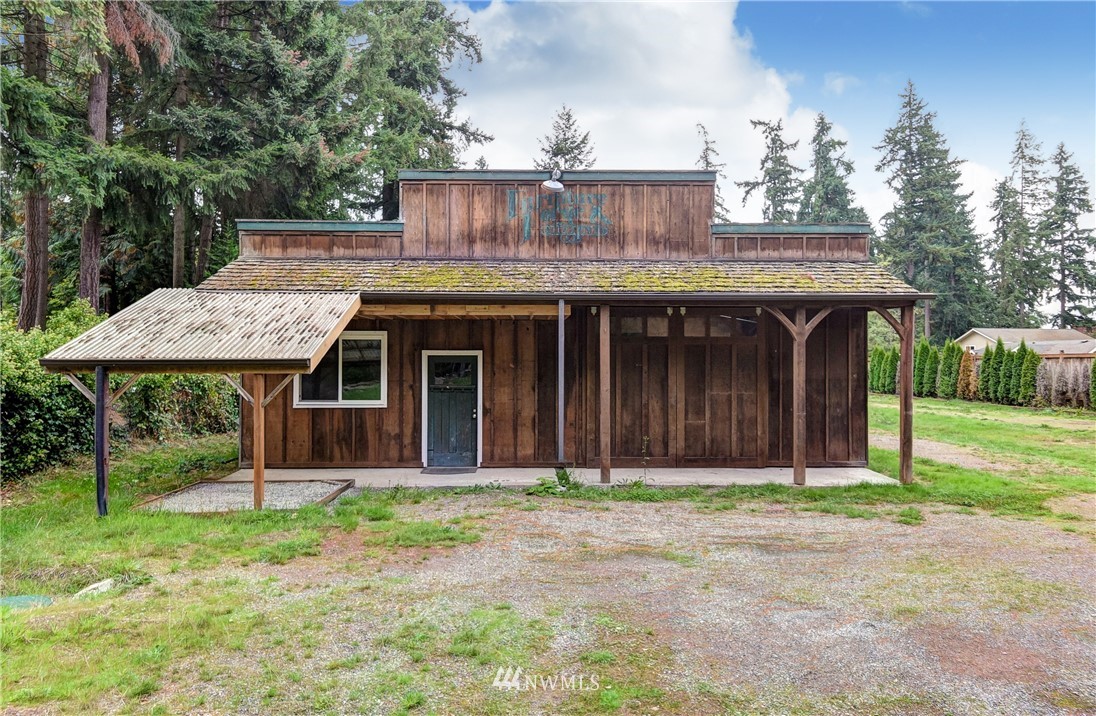 23507 49th Avenue Southeast Bothell, WA 98021 - Photo 1 of 25 a front view of a house with garden