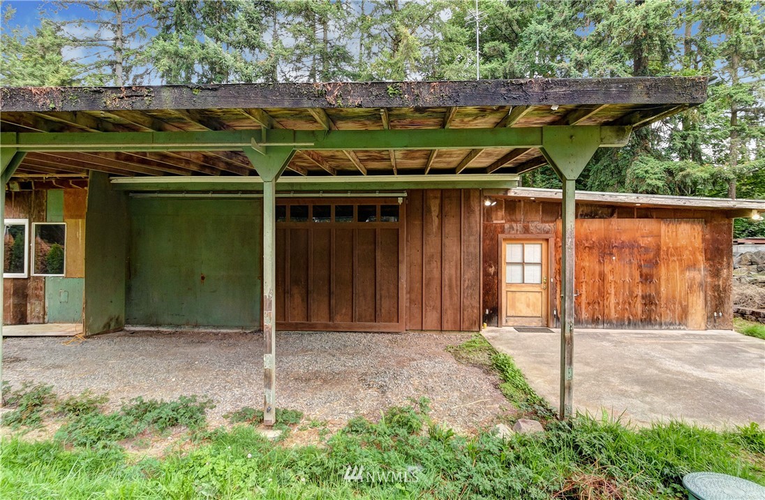 23507 49th Avenue Southeast Bothell, WA 98021 - Photo 19 of 25 a backyard of a house with barbeque oven table and chairs