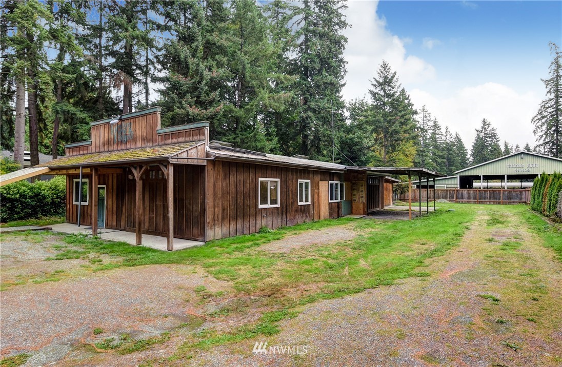23507 49th Avenue Southeast Bothell, WA 98021 - Photo 20 of 25 a front view of a house with garden