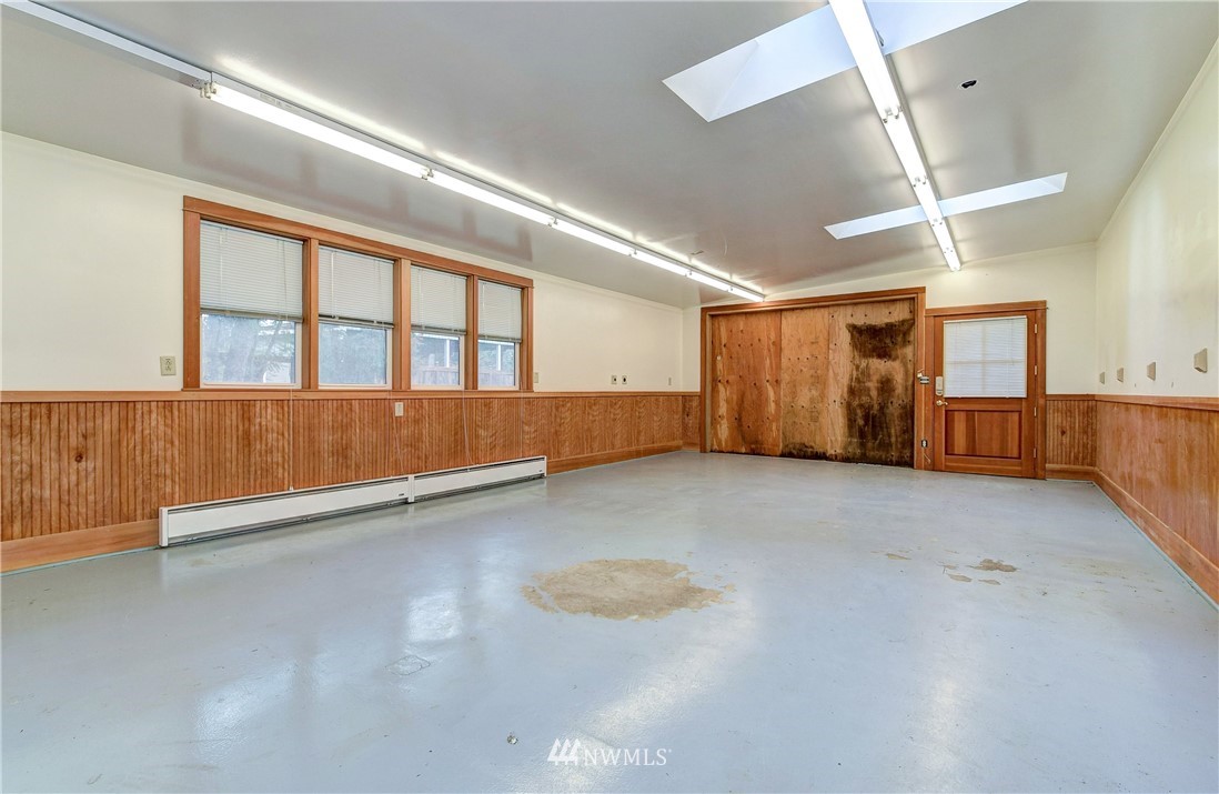 23507 49th Avenue Southeast Bothell, WA 98021 - Photo 5 of 25 an empty room with wooden floor and windows