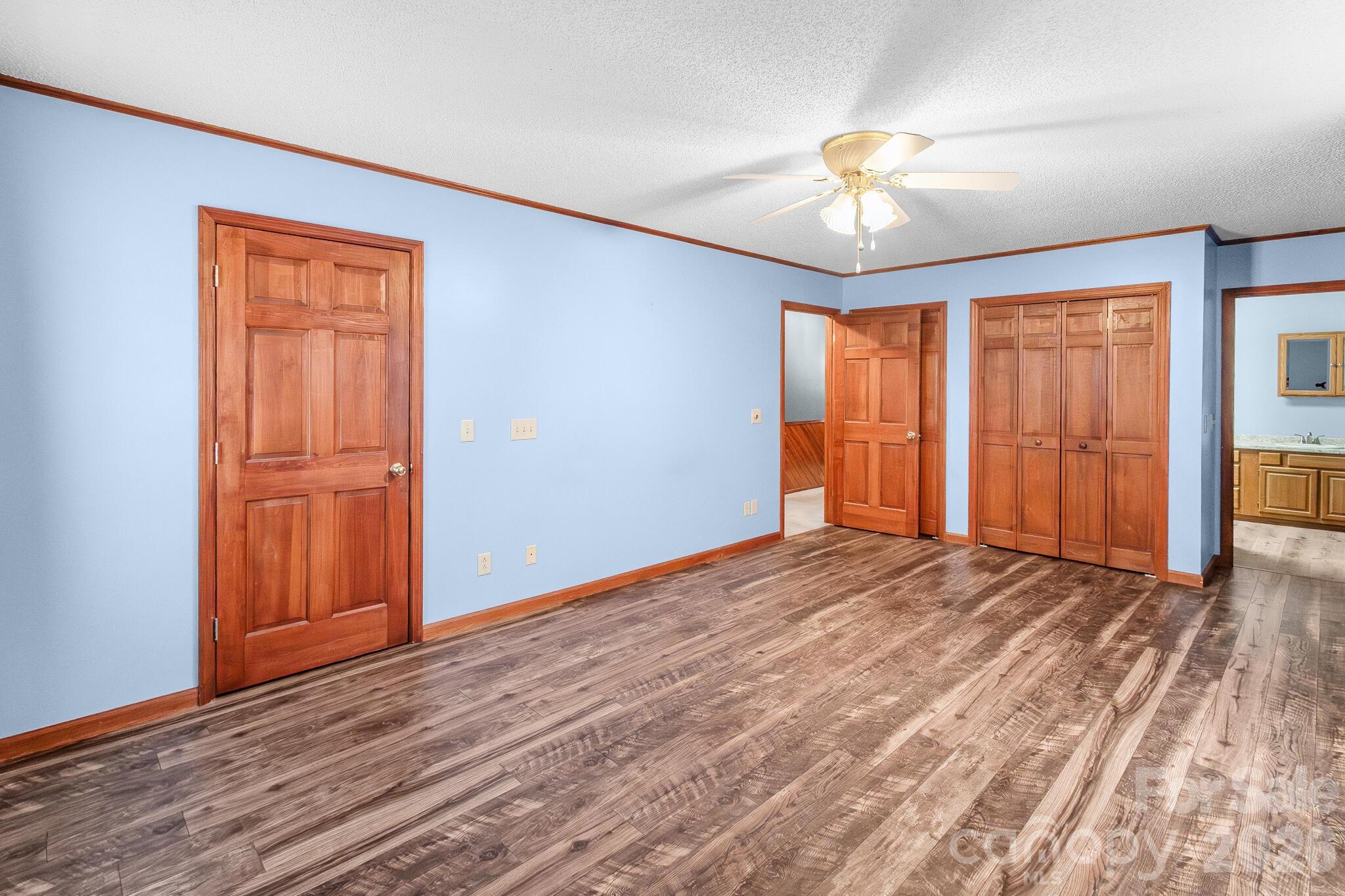 1295 Cattle Ridge Road Cheraw, SC 29520 - Photo 13 of 21 a view of an empty room with window chandelier fan