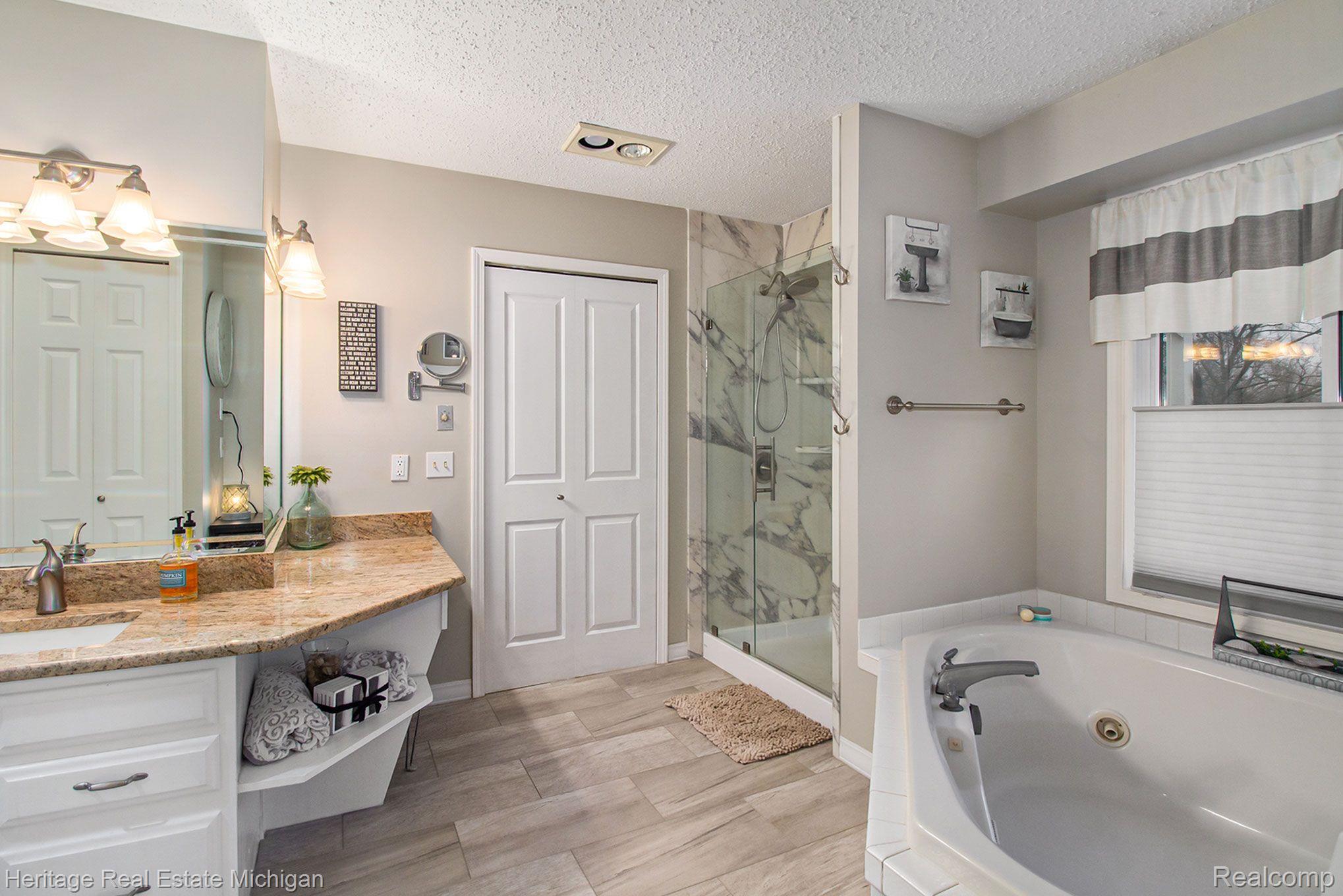 16505 South Seymour Road Linden, MI 48451 - Photo 11 of 33 The master bath is beautifully designed!