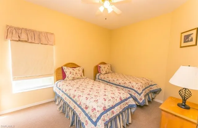 a bedroom with a bed and a night stand