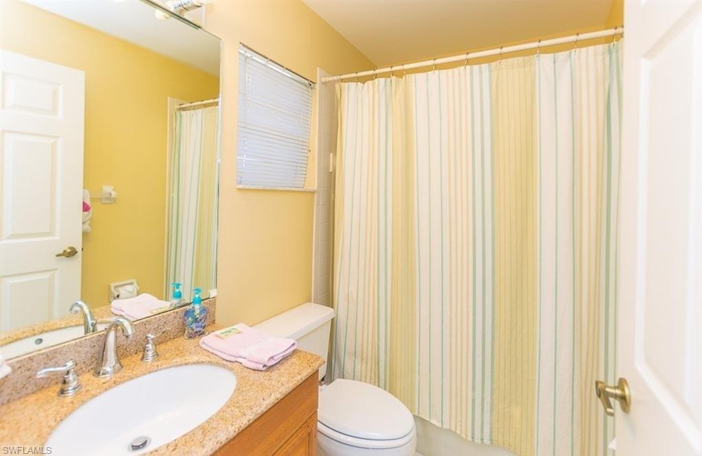 5077 Mabry Drive Naples, FL 34112 - Photo 17 of 24 a bathroom with a sink toilet and shower