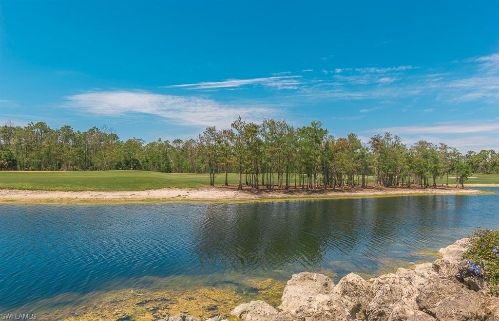 5077 Mabry Drive Naples, FL 34112 - Photo 24 of 24 a view of a lake with a mountain