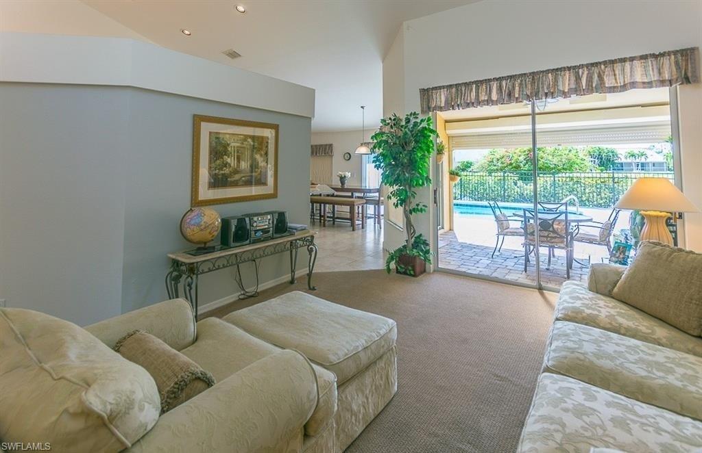 5077 Mabry Drive Naples, FL 34112 - Photo 5 of 24 a bedroom with furniture and a window