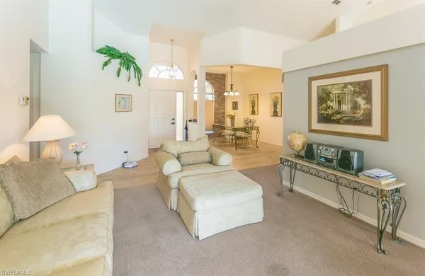 a living room with furniture and a table