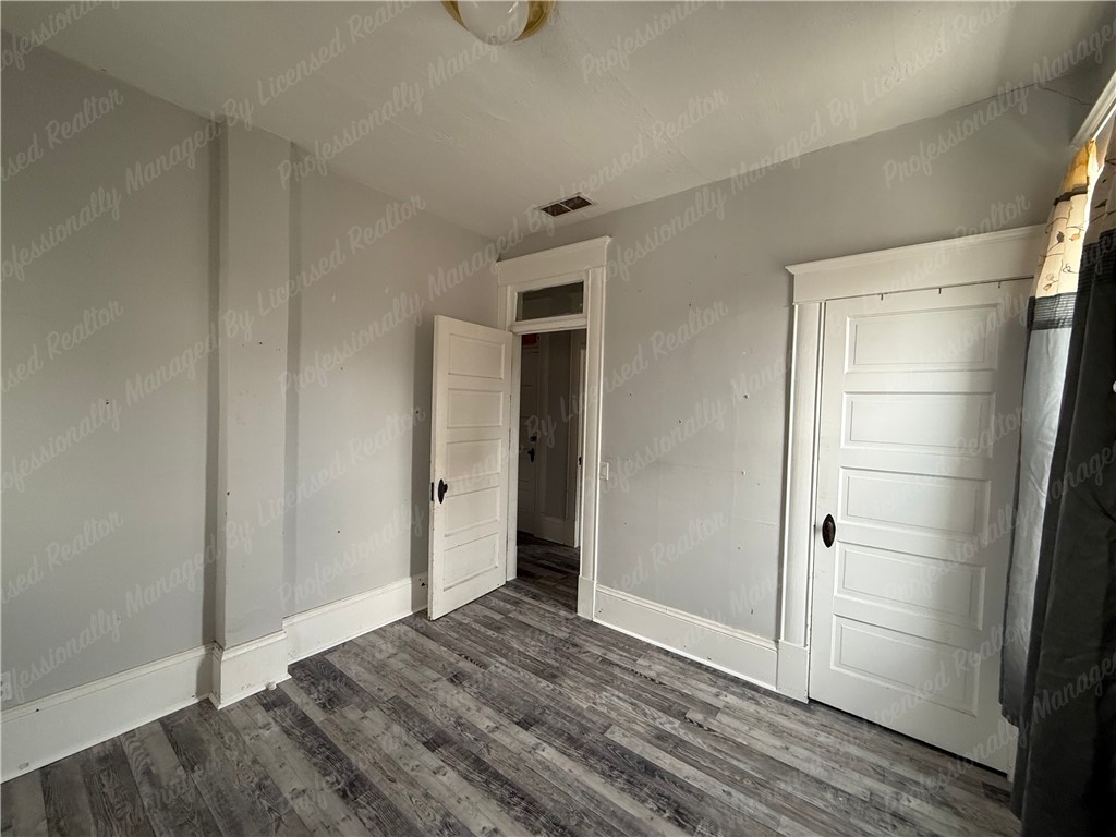 44 West High Street, Unit D Springfield, OH 45502 - Photo 21 of 25 This versatile room features durable flooring, offering a blank canvas for personalization.